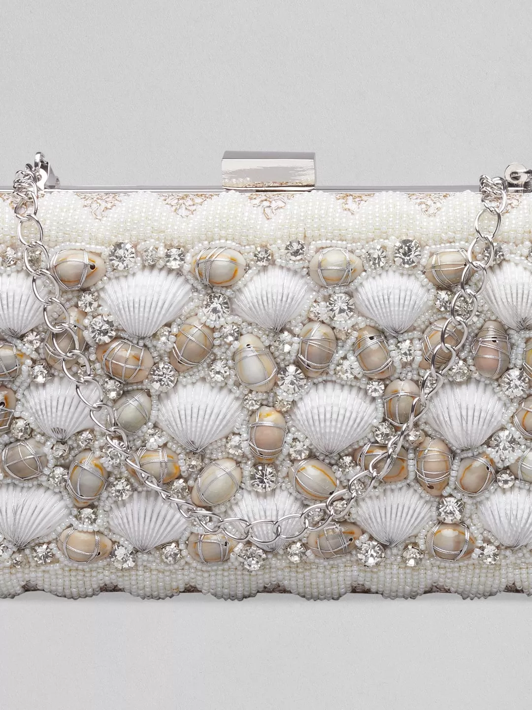 Rubans Off White Coloured Clutch Bag With Shells And Embroided White Design.